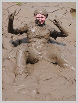  Miss Abigail takes a spectacular mudbath in a tight fitting coated denim jumpsuit featuring Miss Abigail, Mistress of Many Kinks 