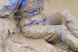 Blue Suit Mud Bath view details of set gm-2m37, Honeysuckle takes a riverbank mudbath in a tight-fitting blue boilersuit, wellies, and gloves.