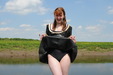 The Latex Mud Maid view details of set gm-4m009, Miss Abigail slops things up in rubber on the mudbanks