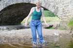 Wet jeans by the old bridge