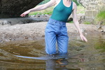 Wet jeans by the old bridge
