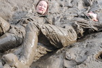 Green waterproofs in the mud