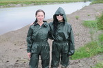Green waterproofs in the mud
